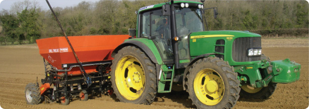 Tractor plowing field